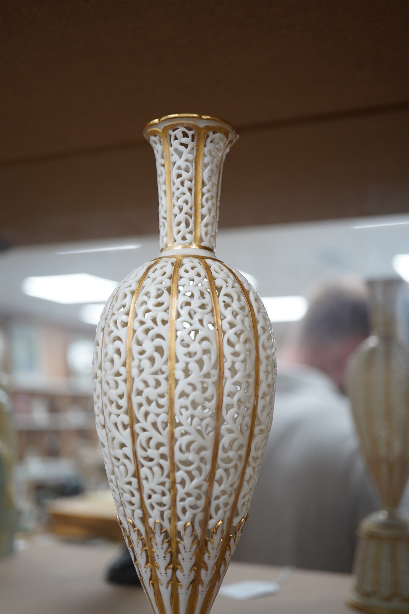 A Grainger's reticulated posy vase with gilded decoration, 29cm high. Condition - good